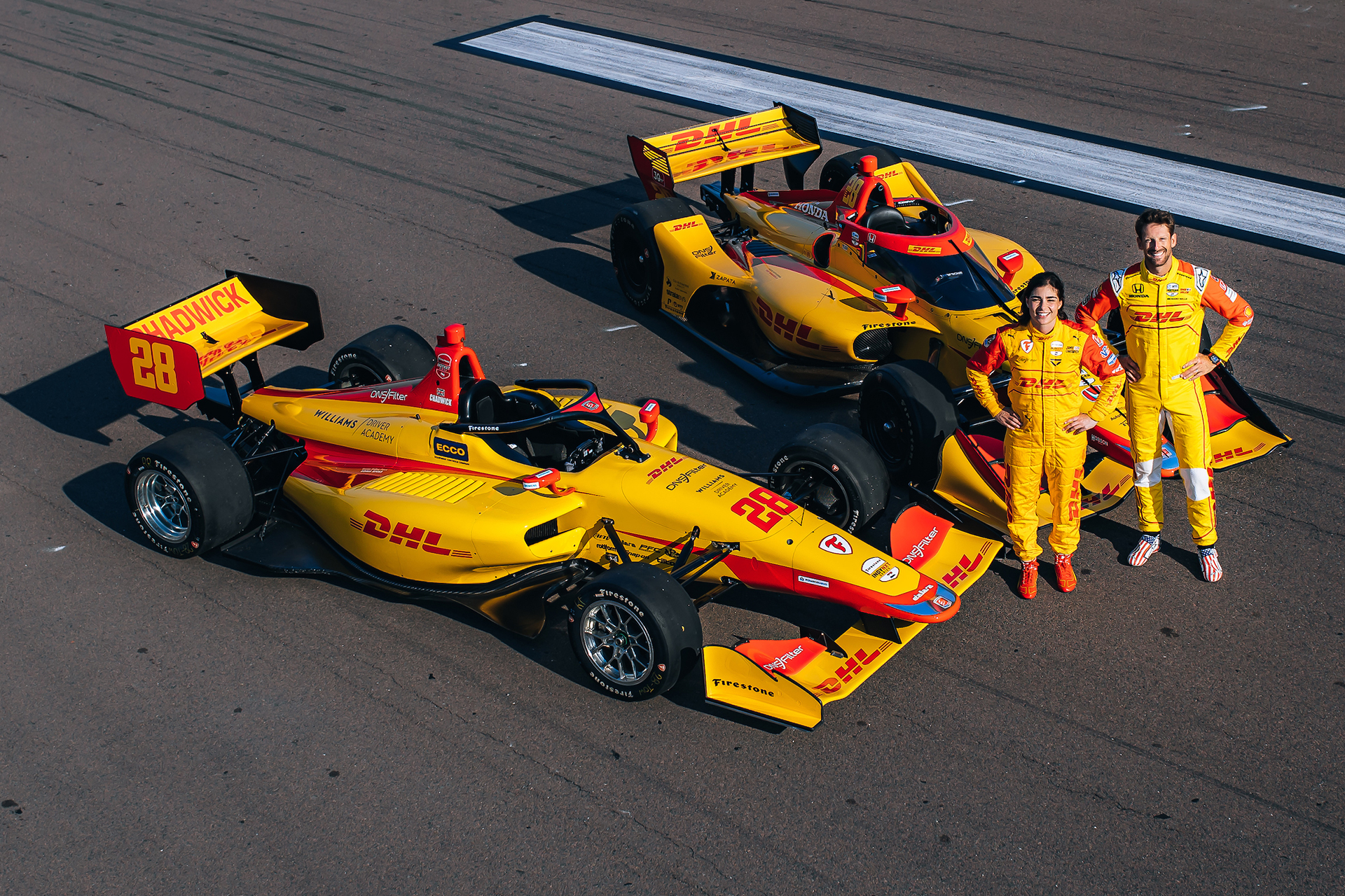 Jamie Chadwick and Romain Grosjean with their DHL sponsored Andretti Autosport Indy NXT and IndyCar race cars